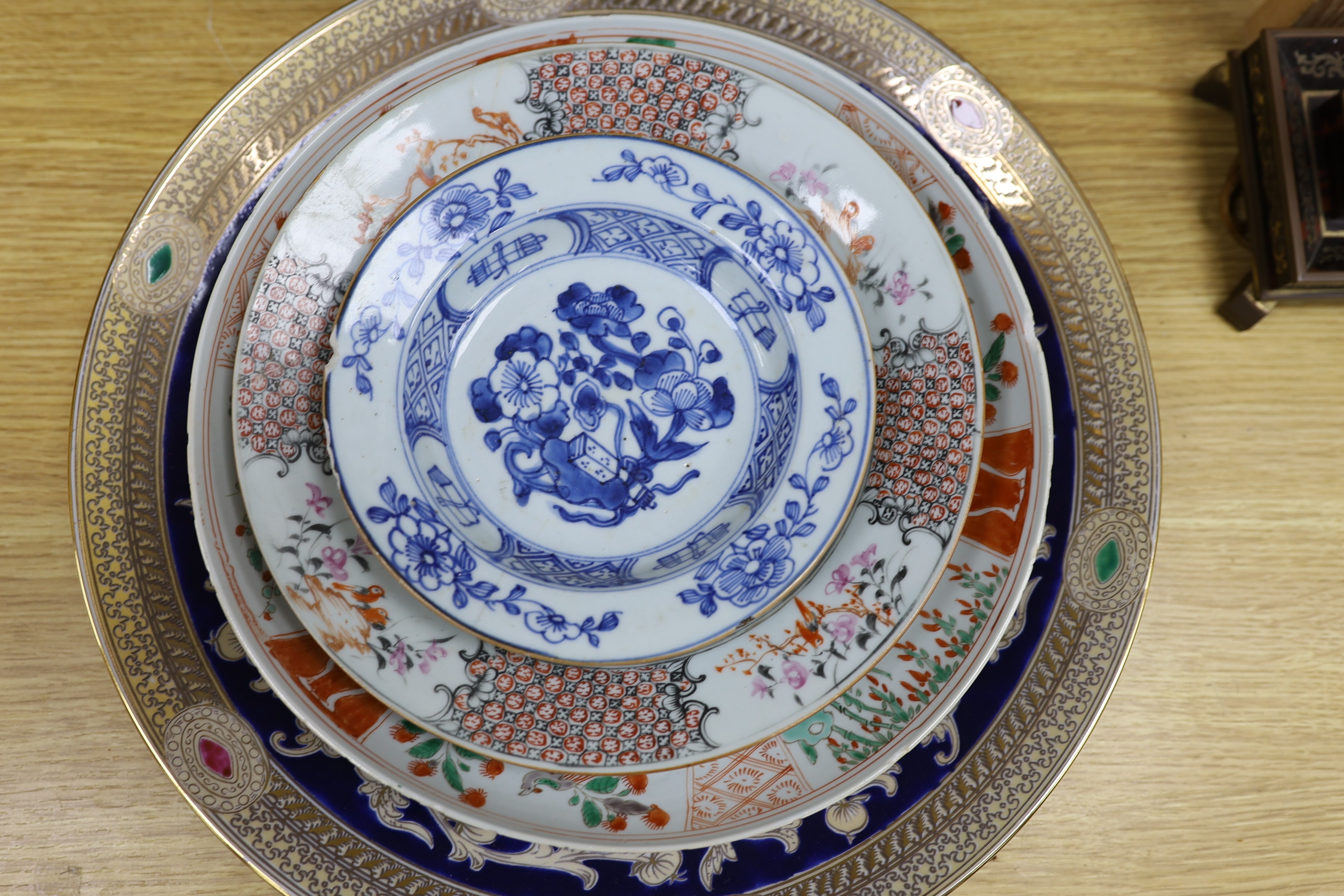 A group of 18th century and later Chinese enamelled and blue and white porcelain dishes and three bowls, Largest dish 35.5 cm diameter